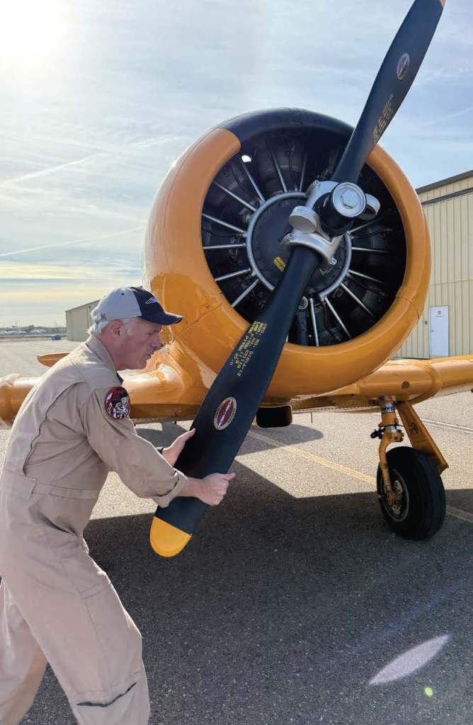 Karl Gashler, a former F-16 pilot and owner of Legends Warbird Rides in Arizona, performs a careful preflight inspection. [Credit: Sean Siff]