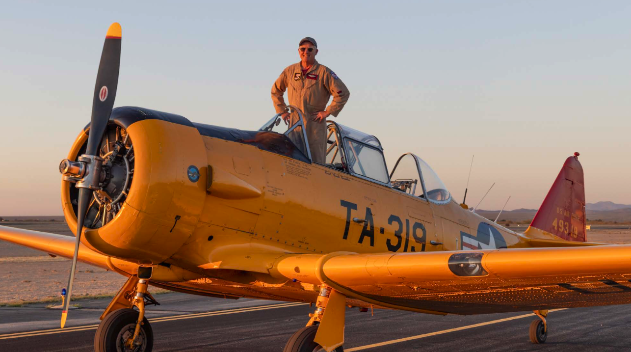 Karl Gashler poses with his T-6, a legendary airplane that trained thousands of World War II aviators for the rigors of flying fighter aircraft. [Credit: David McKay]