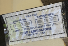 Aircraft sea restraint label depicting rated strength of 1,500 pounds