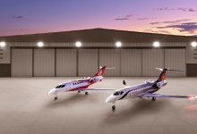 SyberJet SJ34 and SJ36 business jets in front of hangar