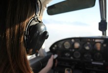 Pilot wearing headset and looking out cockpit window
