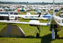 Planes on the field at EAA AirVenture Oshkosh, and plenty of tents under wings [Credit: FLYING Archive]