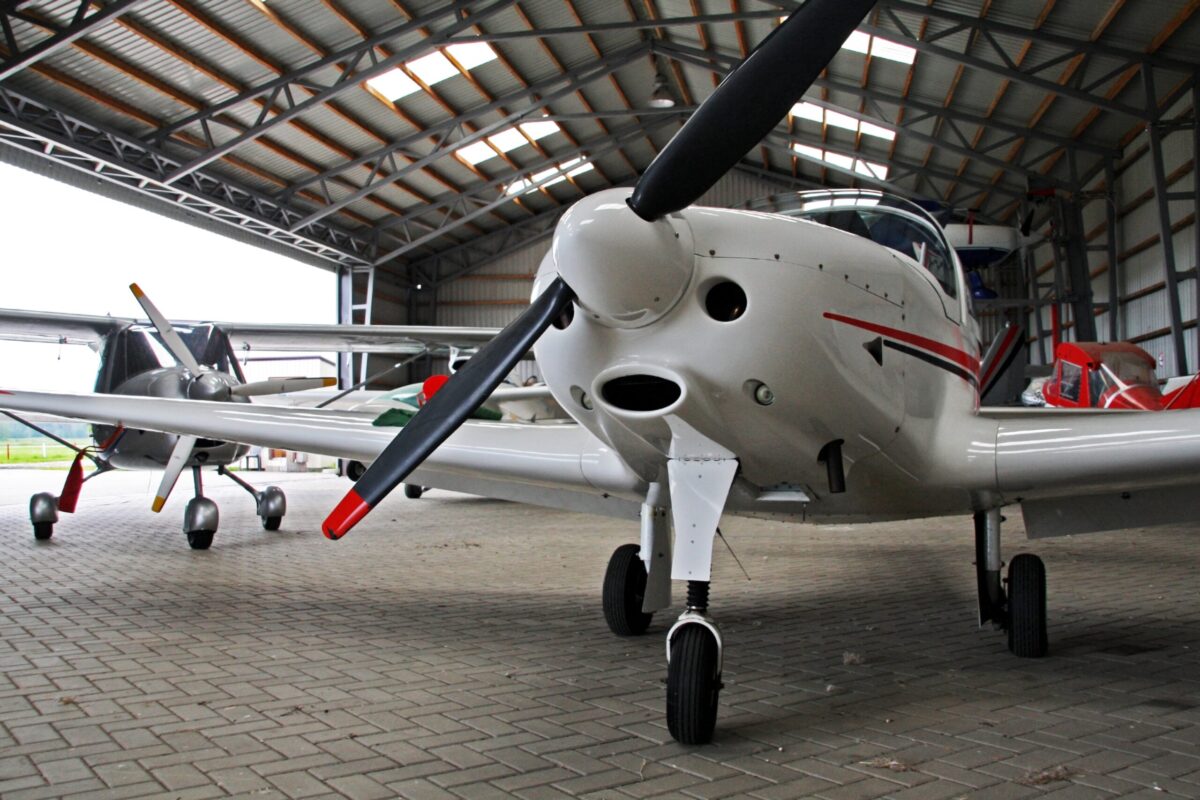 An airplane in a hangar.