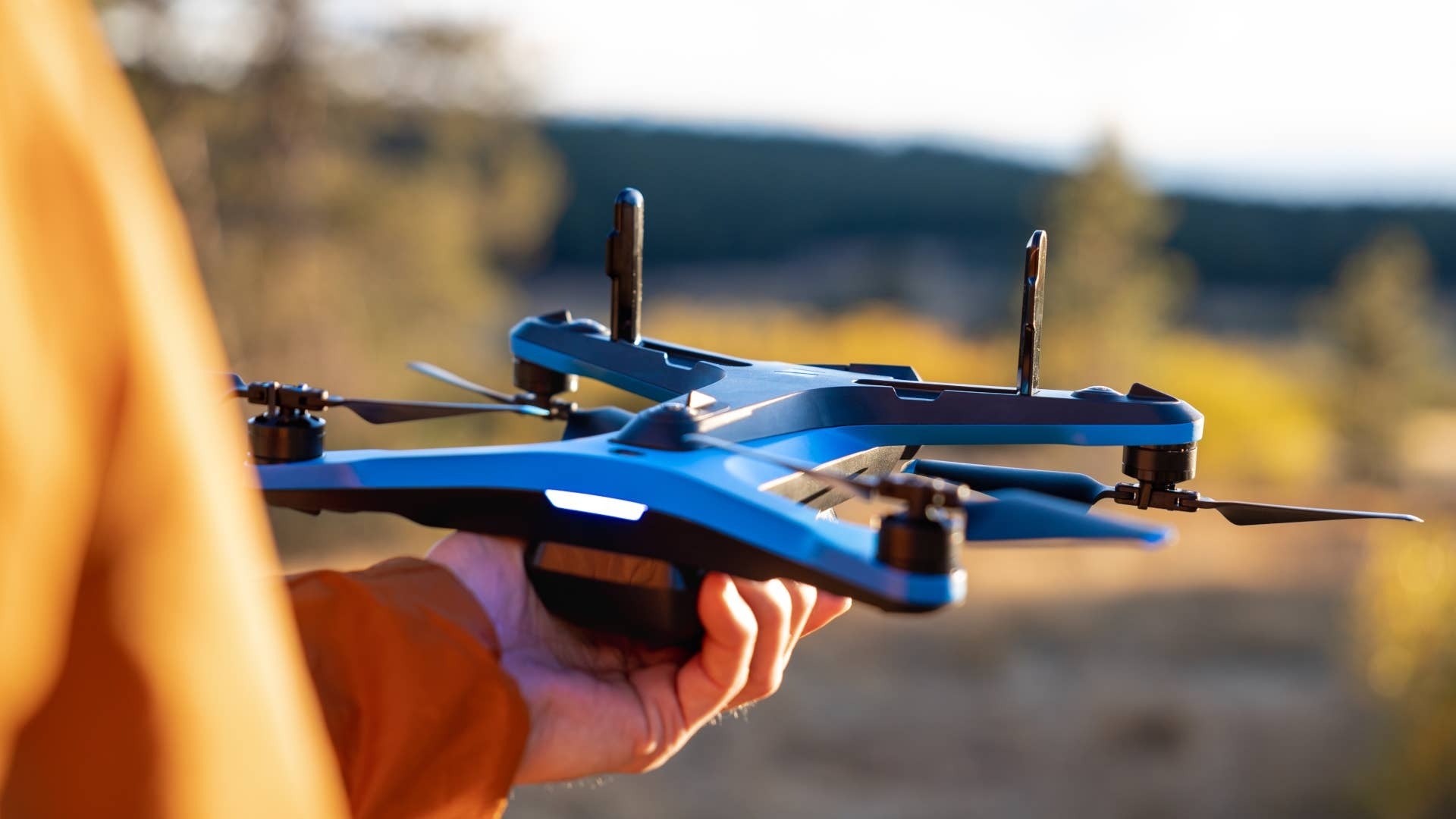 Pilot holding a drone