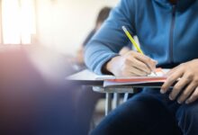 Student in a classroom [Credit: Shutterstock]
