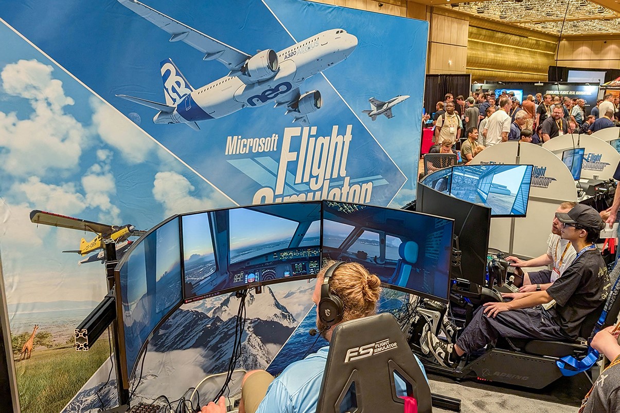 FlightSimExpo attendees at an exhibit in 2024.