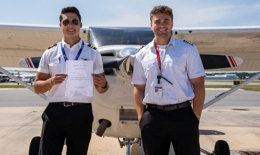Logan Dochtermann (left) became Epic’s first in-house pass when he earned his instrument rating in August 2025. Dochtermann is pictured with his instructor, Breyton Jackson. [Courtesy: Epic Flight Academy]