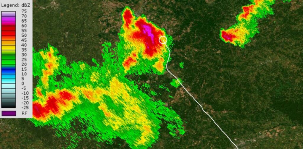 Aerial image with the airplane’s flight track (white) and weather radar reflectivity information overlaid. [Courtesy: NTSB]