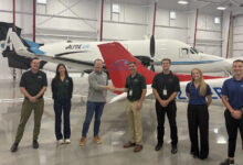 Ray Altmann (from left), Lexi Forester, Matt Klies, Brock Rees, Duke Shepherd, Ashlyn MacVeigh, and Tomas Ruales pose at Epic Flight Academy’s new Provo, Utah, facility.) [Courtesy: Epic Flight Academy]