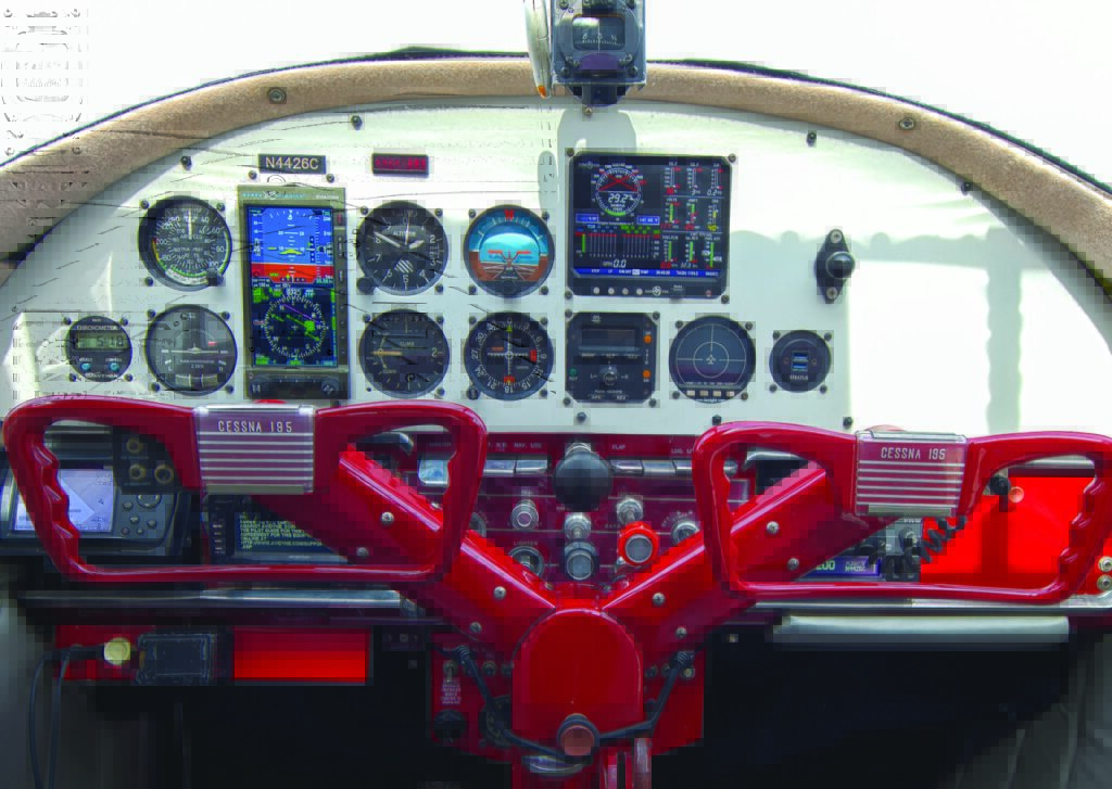The panel's instruments and controls are a functional mix of old and new. [Credit: Glenn Watson]